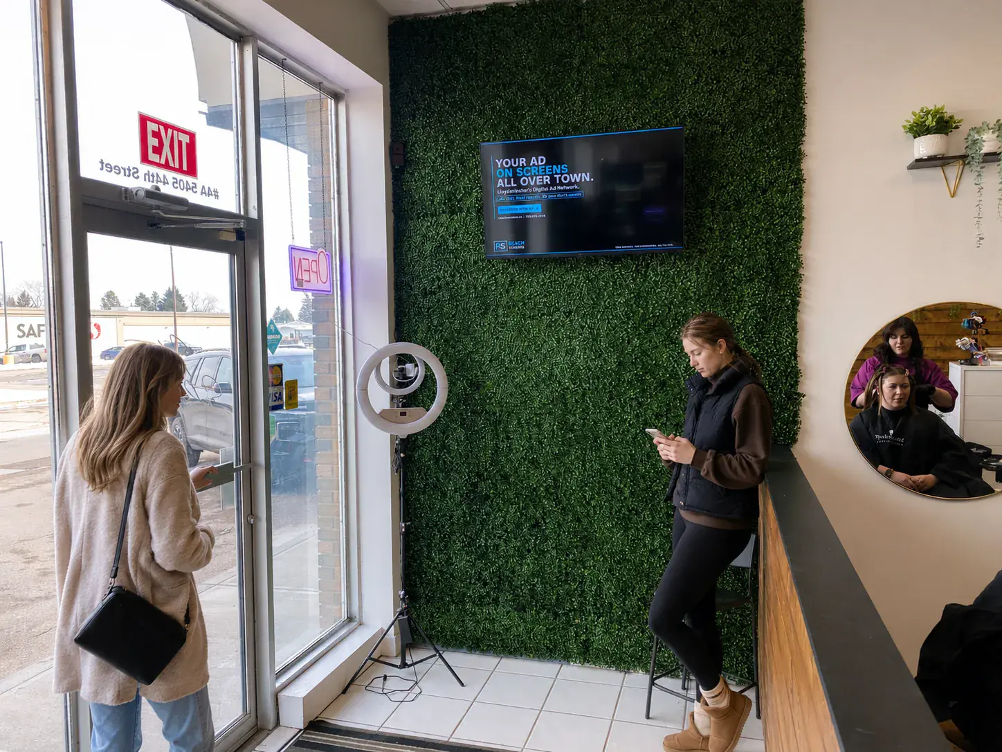 Salon — clients waiting near the screen