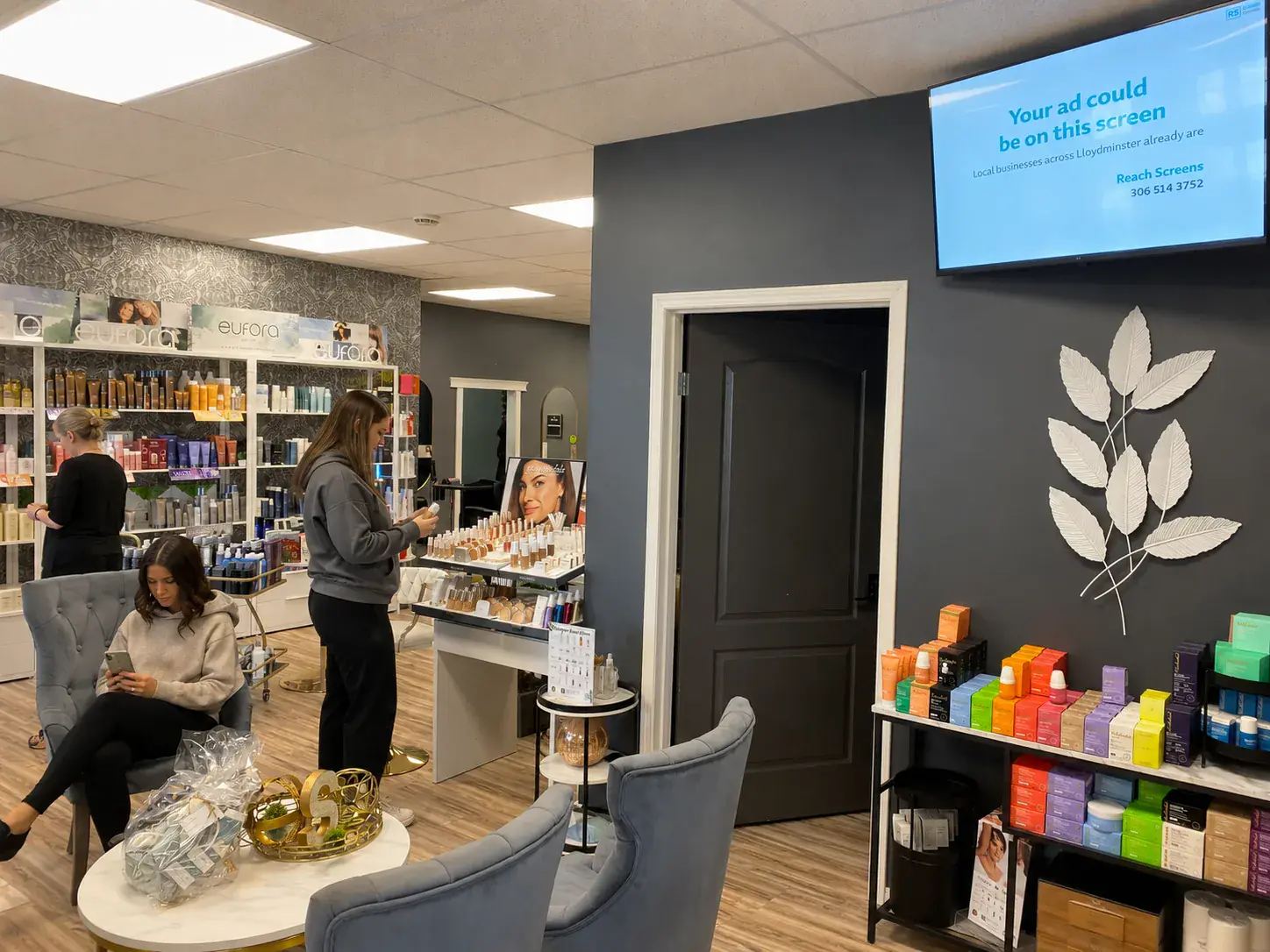 Salon and Spa — customers shopping with the screen above
